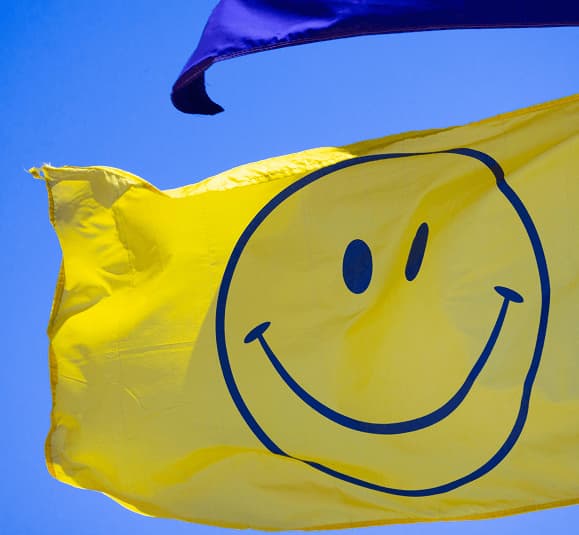 Yellow flag with a smiley face drawing