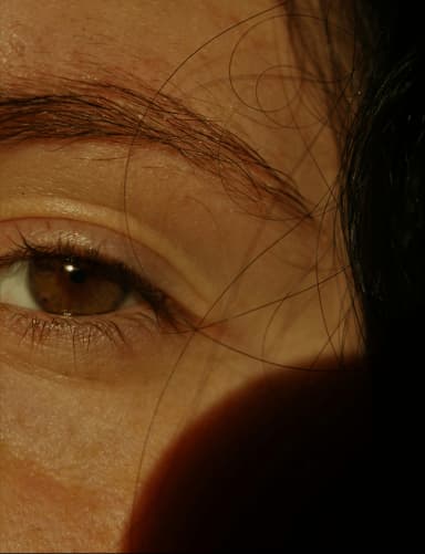 Close-up portrait of a person's eye and face